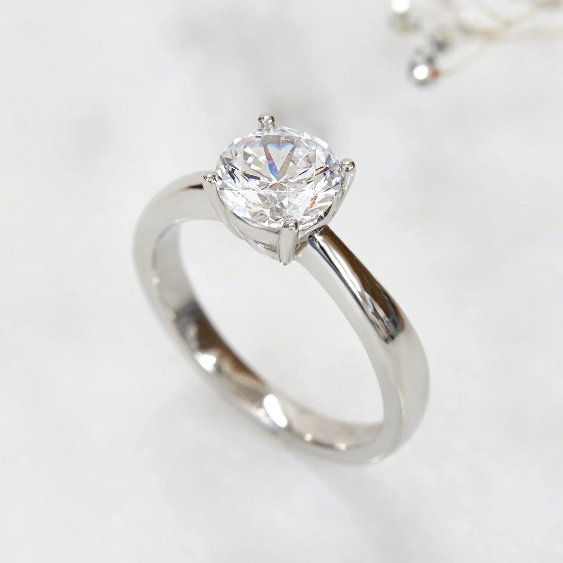 Lustrous Tapered Solitaire Ring. 1.2 CT