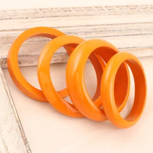 Set of 4 Mango Wood Orange Bangle Bracelets from India - Orange Fusion | NOVICA