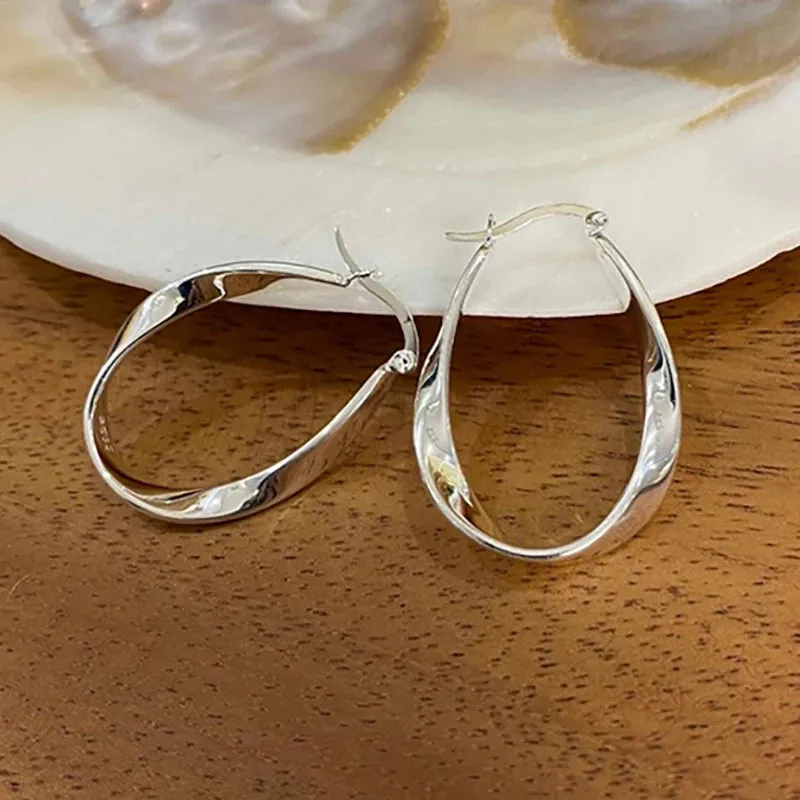 VAIGE Modern Silver Twist Hoop Earrings in Irregular Geometric Design